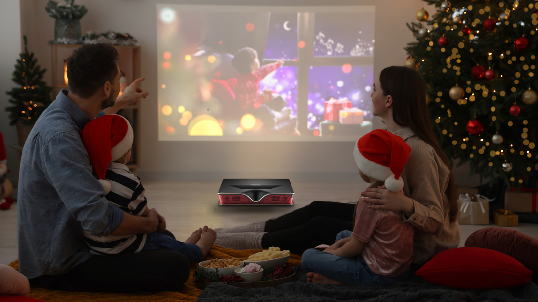 A family celebrating Christmas by watching movie with a P2000 4K ultra short throw home projector